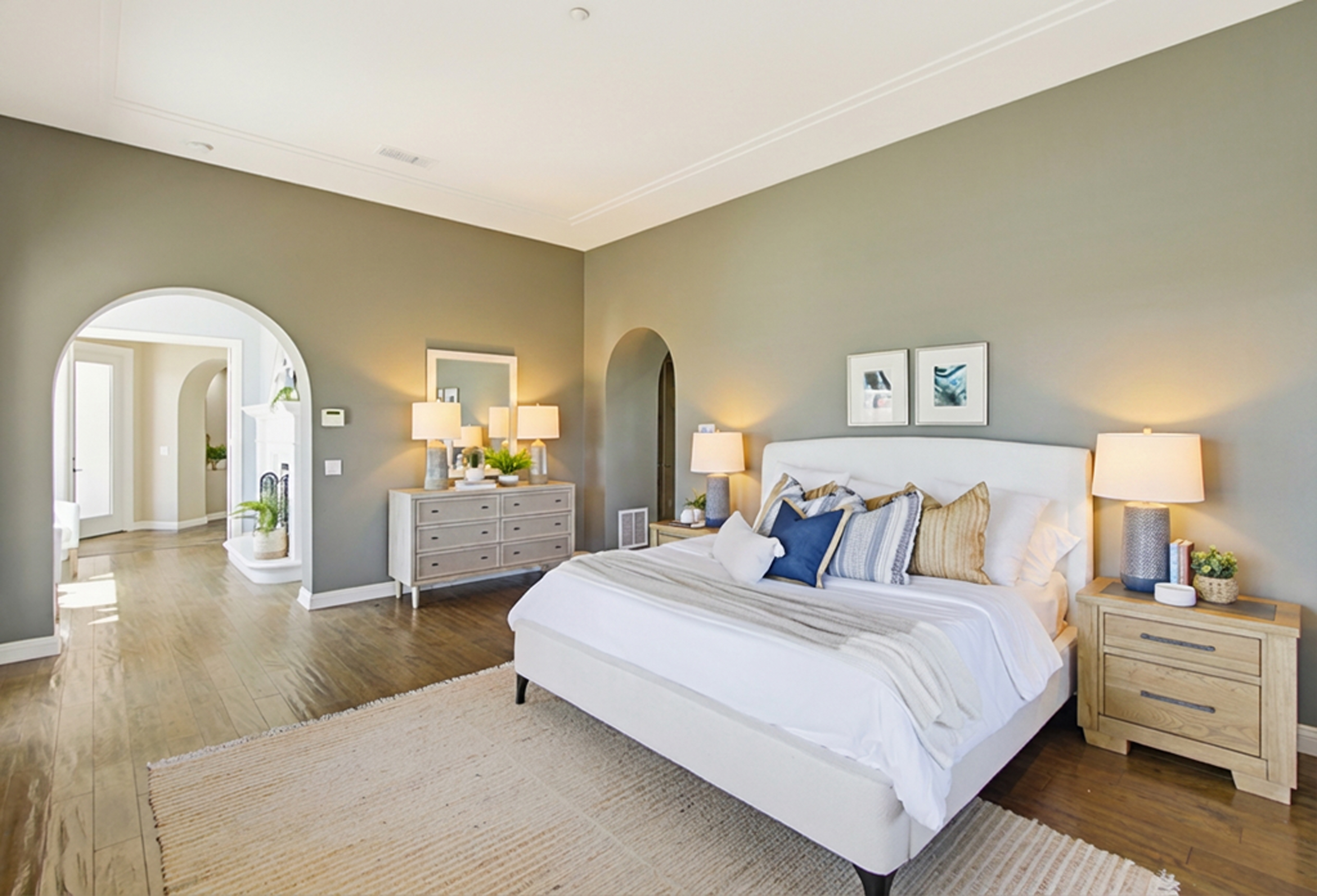 Staged primary bedroom sage green Santaluz San Diego